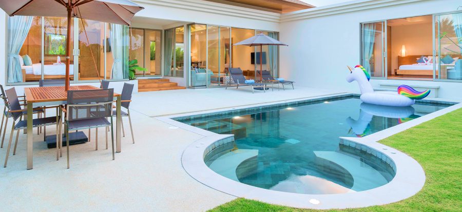 Modern patio with pool and unicorn float.
